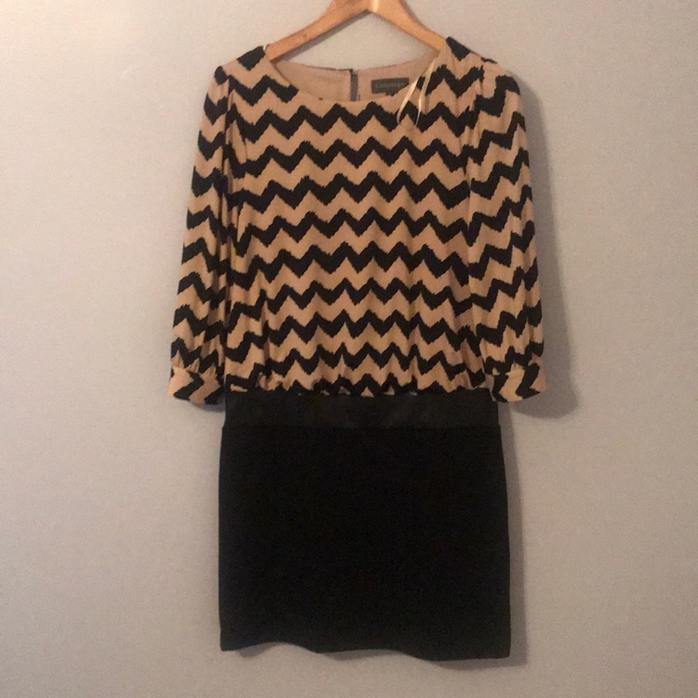 I am selling a knee length luxology dress